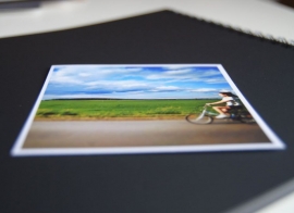 A square photo in a black photo album