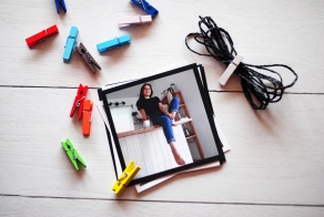 Photo set on clothespins on a rope (black twine)