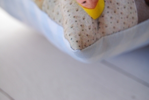 The photo pillow is hand stitched together