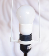 LED (light-emitting diode) lamp inside a floor lamp with photos