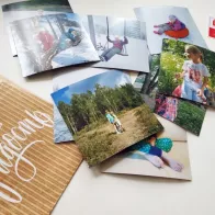 Square photo magnets in an envelope
