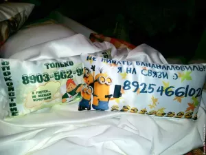 Pillow in the car with a cell phone number