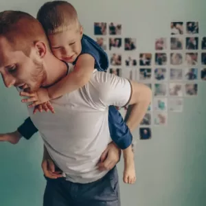 A collage of photos on the wall in the form of a heart