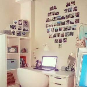 Make a heart out of photos on the wall