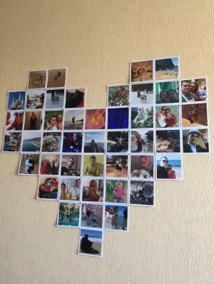 a heart of 46 photos on the wall
