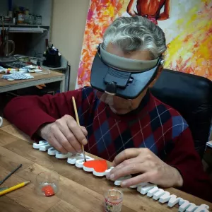 Painting a wedding hashtag out of plastic